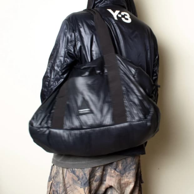 이스트팩x라프시몬스 패디드 더플백