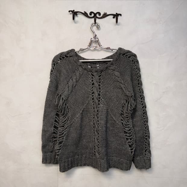 Gray grunge damaged twist net knit