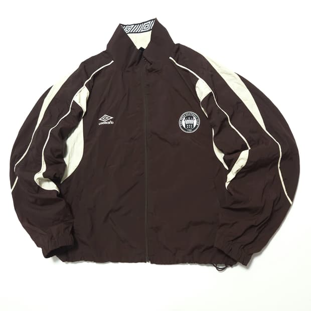 엄브로 프릭스스토어 별주 트랙 바람막이 자켓 브라운