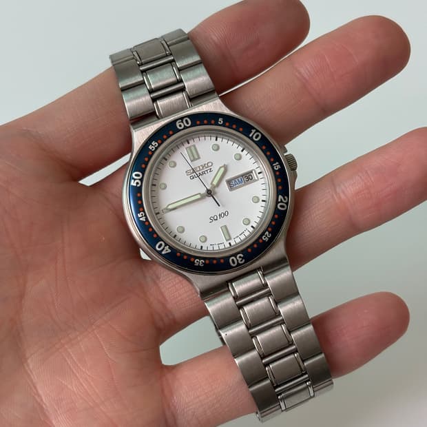 1980s SQ100 Navy Bezel Silver Quartz