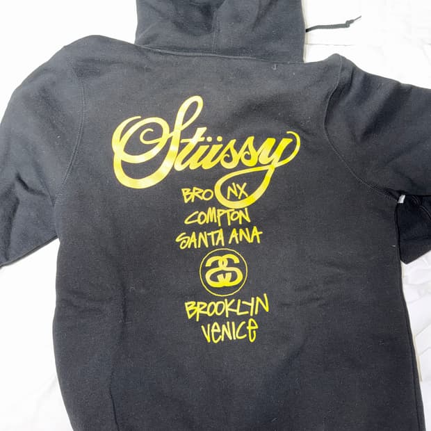 스투시 월드투어 빅로고 후드티 black/yellow