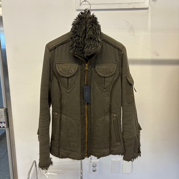 He is s bit khaki jacket