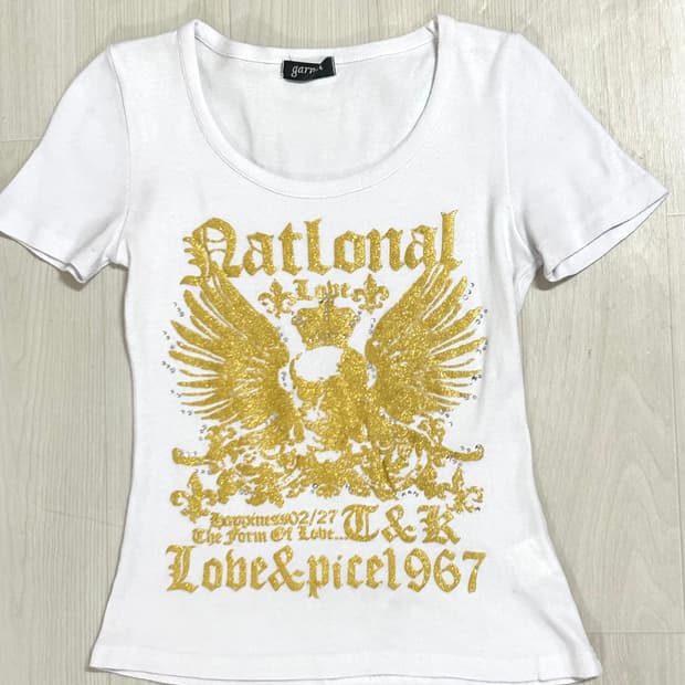 Garnet 골드윙 스컬 프린팅 큐빅 글리터 탑