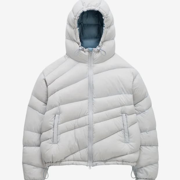 코인서울X밈더워드로브 다이애그널 라이닝 패딩 스카이블루