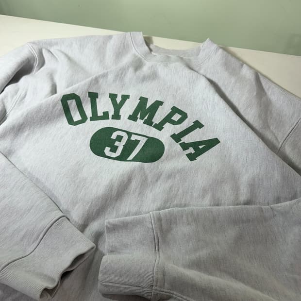 M 100 아웃스탠딩 멜란지그레이 오버핏 OLYMPIA 스웻셔츠 맨투맨