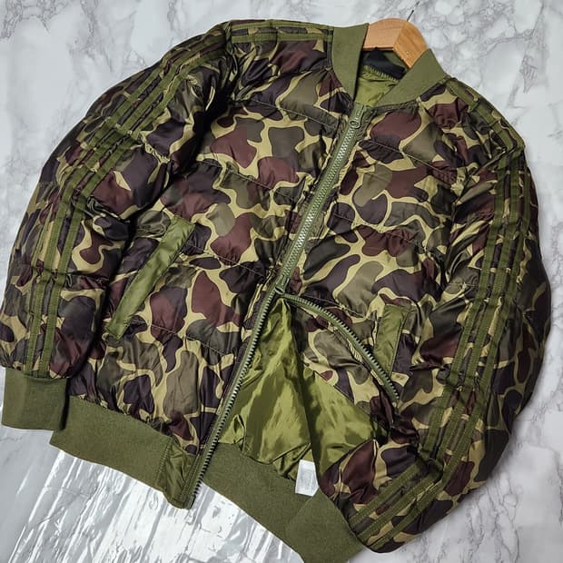 아디다스 오리지널스 x 퍼렐 휴 하이킹 카모 패딩 자켓