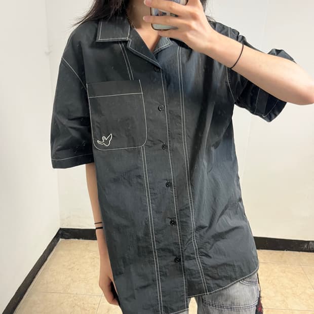 What It Isn’t Nylon Shirt