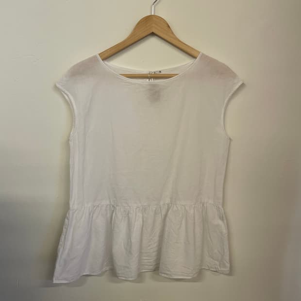 Flared frill sleeveless top