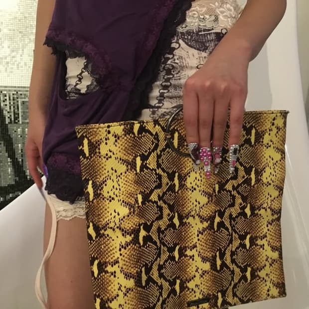 Python yellow clutch bag