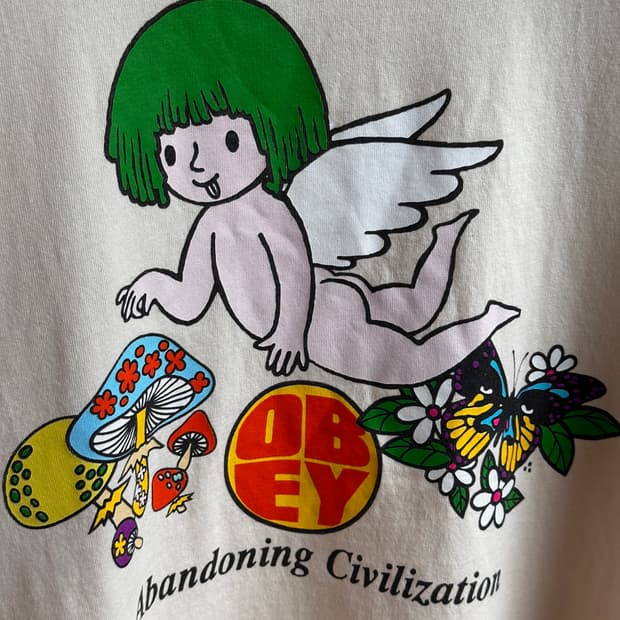 [OBEY] 오베이 어밴더닝 시빌라이제이션 엔젤 그래픽 반팔 티셔츠 버터