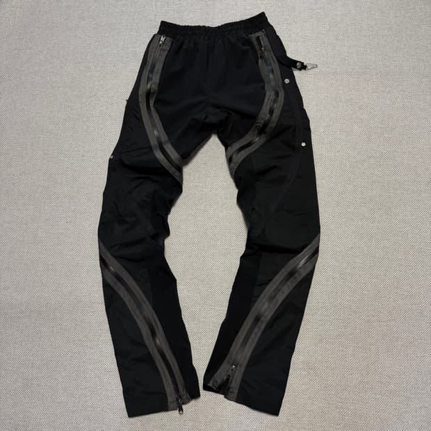 언더마이카 리전01 트위스트 지퍼 라인 테이핑 팬츠