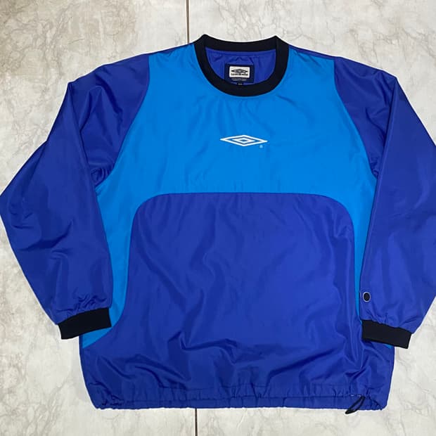 엄브로 풀오버 웜업 바람막이자켓 105