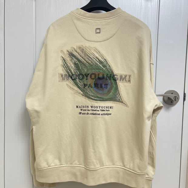 우영미 깃털 백로고 맨투맨 아이보리 48