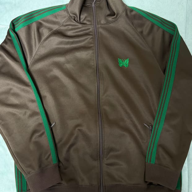 니들스 LHP 별주 트랙자켓 브라운