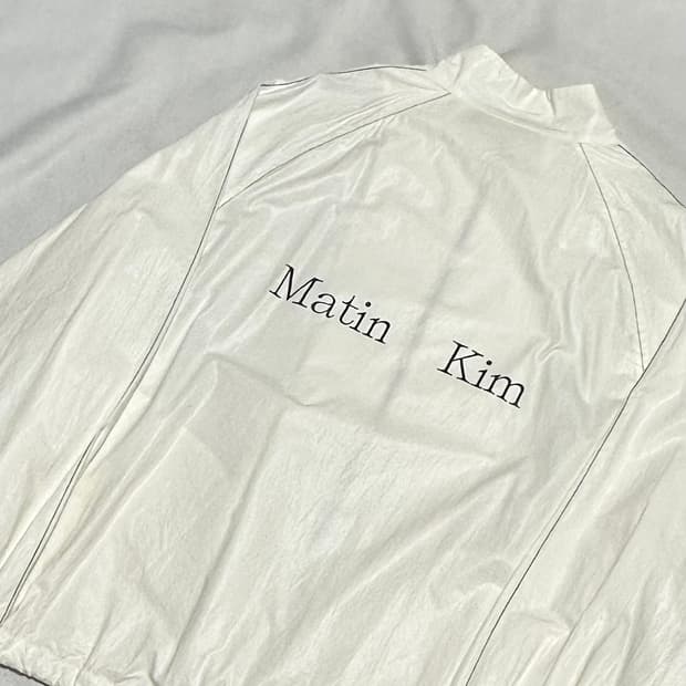 F 마뗑킴 로고 코팅 화이트 바람막이