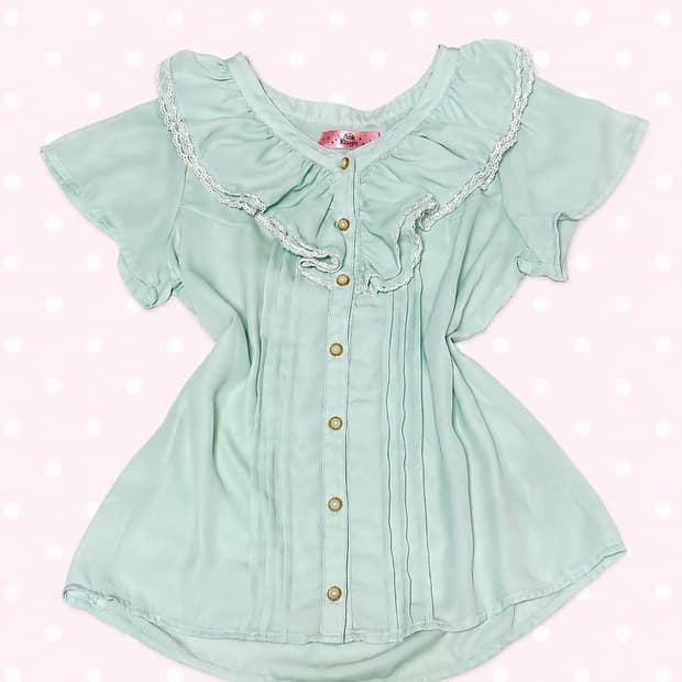 앙크루즈 민트 프릴 로걀 탑