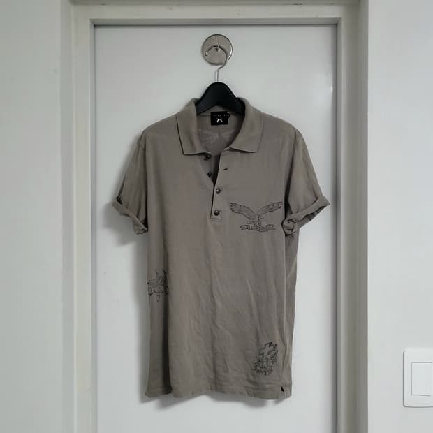 Roar tatooed skin polo