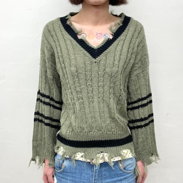 Distressed khaki knitwear