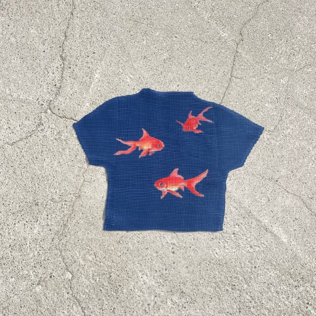 Orange fish friends pleats top