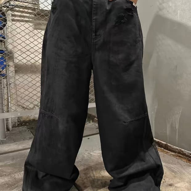 Coated black wide denim pants