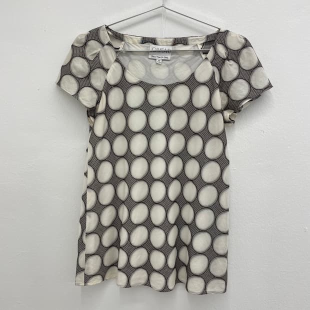 Abstract circle print cap sleeve blouse