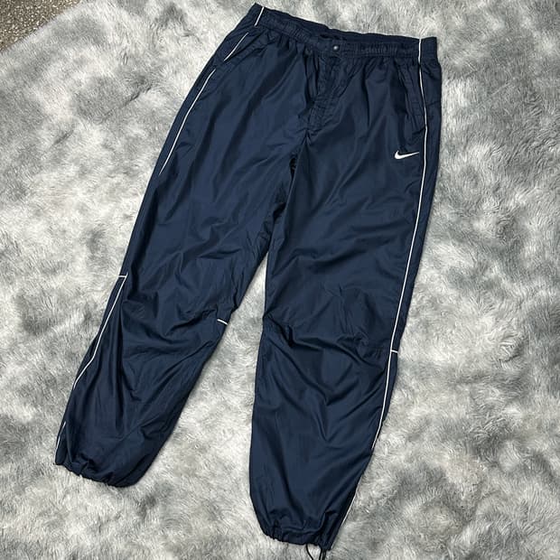 나이키 스우시 우븐 오버핏 트랙팬츠 L