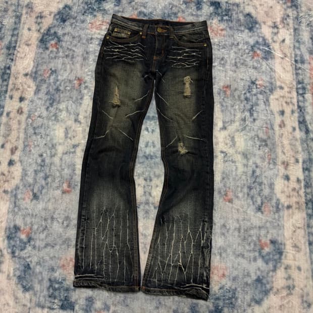 Black baccara wave washed boot cut denim
