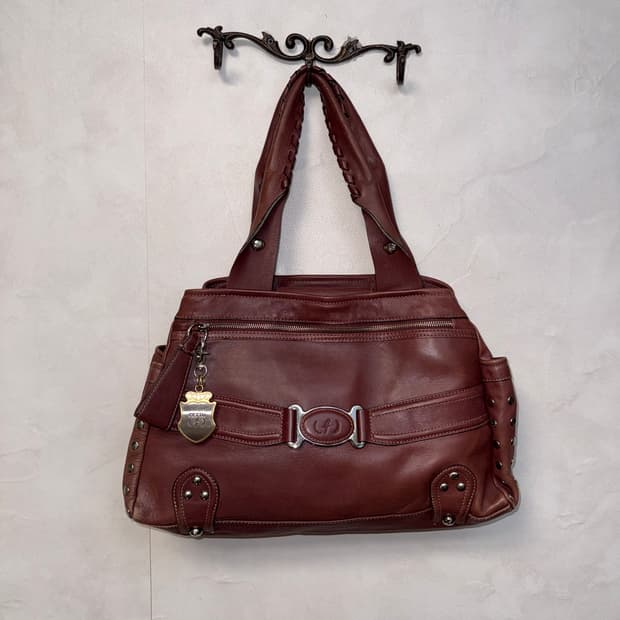 Cettu brick red cow skin stud tote bag